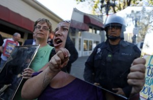 Demonstrators supporting protesters in Ferguson, Mo., hold up mirrors to police during a march Wednesday in Oakland. Photo: Scott Strazzante, The Chronicle 