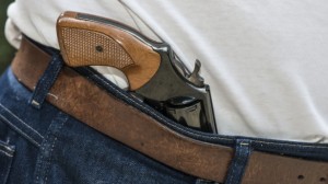 Gun-in-jeans-waistband-via-Shutterstock-615x345