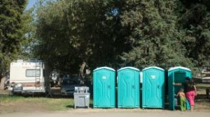 Porta-potties are delivered the morning of Tuesday, Sept. 16, 2014 at Eagle's Nest Resort in Porterville, Calif., because the well went dry.