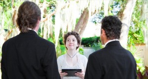 Female minister uses a tablet PC to perform a same-sex marriage ceremony  Credit: Shutterstock