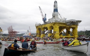 "Kayak-tivists" gathered to protest Shell Oil Company's drilling rig Polar Pioneer parked at the Port of Seattle.  Credit: Jason Redmond / Reuters