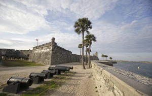 In this Tuesday, Feb. 3, 2015 photo, the Castillio de San Marcos fort, built over 450 years ago, is separated from the Matanzas River by a sea wall in St. Augustine, Fla. St. Augustine is one of many chronically flooded Florida communities afraid their buildings and economies will be inundated by rising seas in just a couple of decades.  Credit: AP/John Raoux) Photo by The Associated Press/Times Free Press. 