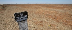 TRANQUILLITY, CA - APRIL 19:  A no trespassing sign stands over cracked ground in an unplanted field on April 19, 2009 near Tranquility, California. Central Valley farmers and farm workers are suffering through the third year of the worsening California drought with extreme water shortages and job losses.  Credit: The Huffington Post