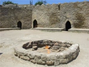 The “eternal flame” at the Zoroastrian Ateshgah “Fire Temple” near Baku, Azerbaijan. The temple was built over natural burning seeps that are today extinct. The flame in the photo is now artificially fed via a gas pipe. Active natural flames are instead found at Yanardag, located approximately 9 km NE. Credit: Guisepe Etiope