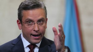 Puerto Rico Gov. Alejandro Garcia Padilla delivers his budget address for the next fiscal year at the Capitol building in San Juan. Puerto Rico's governor believes the U.S. territory's $72 billion public debt is unpayable, his spokesman confirmed late Sunday, June 28, 2015, adding another blow to the international financial system already struggling with a possible default by Greece.  Credit: AP Photo/Ricardo Arduengo