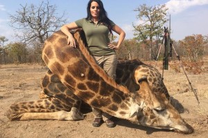 Sabrina Corgatelli poses with the carcass of a giraffe.  Credit: Sabrina Corgatelli/Facebook