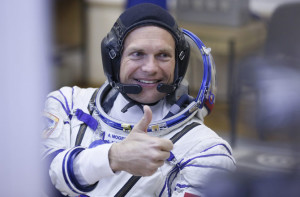 Denmark's astronaut Andreas Mogensen gives a thumb up before boarding the Soyuz TMA-18M rocket just a few hours before his launch to the International Space Station. SERGEI ILNITSKY/epa/Corbis