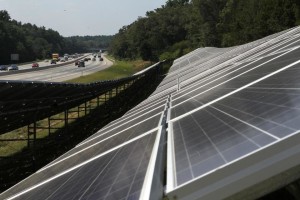 Two solar farms alongside the Mass. Pike contain 2,100 panels each. Credit: Joanne Rathe/Globe Staff