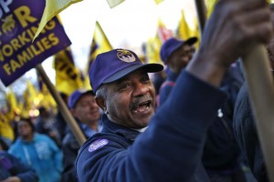 Members of the Service Employees International Union march during a protest in support of a new contract for apartment building workers in New York City, April 2, 2014.  Credit: Reuters/Mike Segar