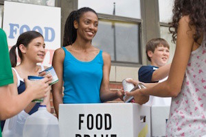 People volunteering at food drive