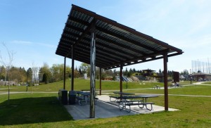 A couple of dozen solar panels sit atop a picnic shelter at a neighborhood park in Seattle. Credit: Seattle CIty Light