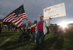 Ganovana Ayala of Boulder, Colo., holds a sign while attending a Latino voting rally on the campus of the University of Colorado before the Republican presidential debate Wednesday, Oct. 28, 2015, in Boulder, Colo.  Credit: AP Photo/David Zalubowski