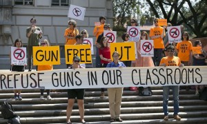 Protestors gather in October at the University of Texas campus to oppose a new state law that expands the rights of concealed handgun license holders to carry their weapons on public college campuses. Credit: Ralph Barrera/AP 