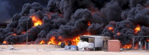 Smoke rises from burning oil storage tanks in the port of Ras Lanuf, Libya, January 23, 2016. Credit: Der Spiegel