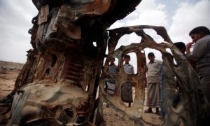 Boys gather near the wreckage of car destroyed by a US drone airstrike targeting suspected al-Qaida militants in Azan, Yemen, in 2013. Photograph: Khaled Abdullah/Reuters 