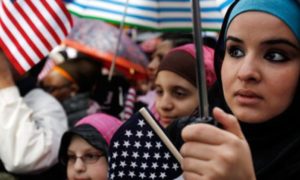 American Muslim women waving flags