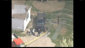 Investigators at one of multiple homes where a total of eight family members were shot and killed on Friday, April 22, 2016, in Peebles, Ohio. Credit: CBS affiliate WBNS