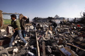 People search for belongings amid the wreckage of the damaged school cafeteria near an amusement park after it was hit by Saudi-led air strikes in Yemen's capital Sanaa, February 12, 2016. Credit: Reuters/Mohamed al-Sayaghi