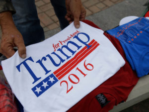 A vendor sells Donald Trump t-shirts before a rally for Republican presidential candidate Donald Trump in Carmel, Ind., Monday, May 2, 2016. Credit: Michael Conroy/AP