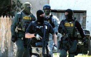 Drug Enforcement Agents from the DEA conducting a raid in Los Angeles. The Federal Government will make Marijuana a Schedule Two drug on August 1, 2016, effectively legalizing weed throughout the US.