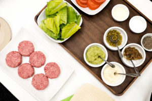  Silicon Valley-based Impossible Foods has taken a high-tech approach to creating a plant-based burger that smells and tastes like real meat. At the company's headquarters in Redwood City, Calif., chef Traci Des Jardins served the Impossible Burger (pictured uncooked) with vegan mayo, Dijon mustard, mashed avocado, caramelized onions, chopped cornichon, tomato and lettuce on a pretzel bun. Credit: Maggie Carson Jurow