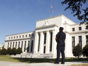 A Federal Reserve police officer keeps watch while posted outside the Federal Reserve headquarters in Washington September 16, 2015. Credit: Reuters/Kevin Lamarque