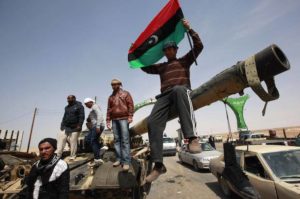 Libyan rebels on a tank outside the town of Ajdabiyah on March 26, 2011 Credit: Reuters/Andrew Winning)