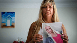 Kim Grajcar of West Palm Beach holds a photo of her daughter Samantha, who died of a heroin overdose. CreditBruce R. Bennett/Palm Beach Post/ZUMA