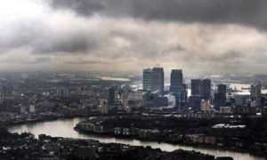 Storm clouds above Canary Wharf financial district in London.  Credit: Andy Rain/EPA 