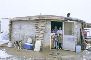 Navajo Reservation family in the doorway of their house. Credit: Daily Mail