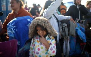  A young girl walks to receive free back-to-school supplies from the Fred Jordan Mission on Skid Row in Los Angeles, California.  Credit: Reuters / Lucy Nicholson